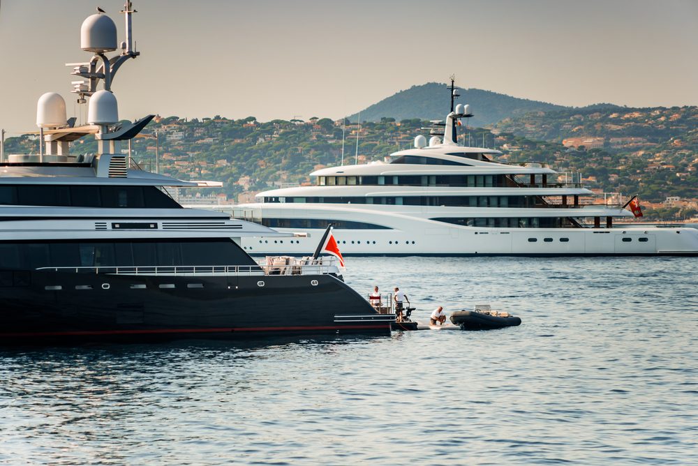 two yachts anchored on water